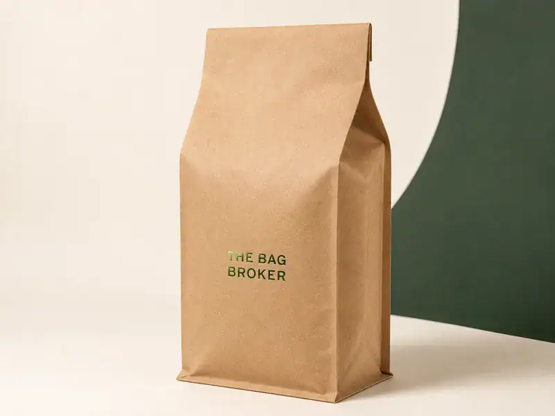 Hot stamp foil die pressing a single-colour mark onto a kraft coffee bag